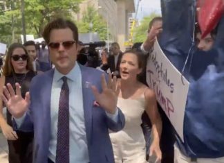 Matt Gaetz Wrong Place, Wrong Time Next to ‘Pedophiles For Trump’ Sign