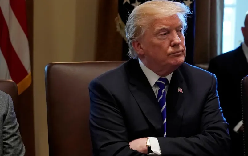 Trump arms crossed