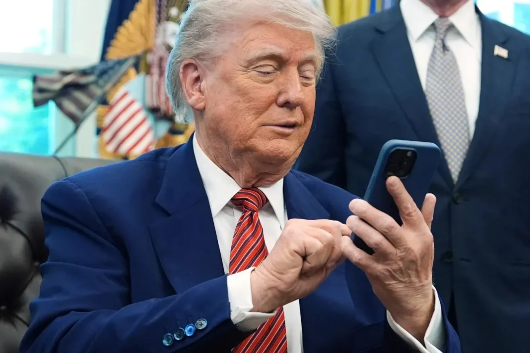 Trump with his Cell Phone A 12-02-2025